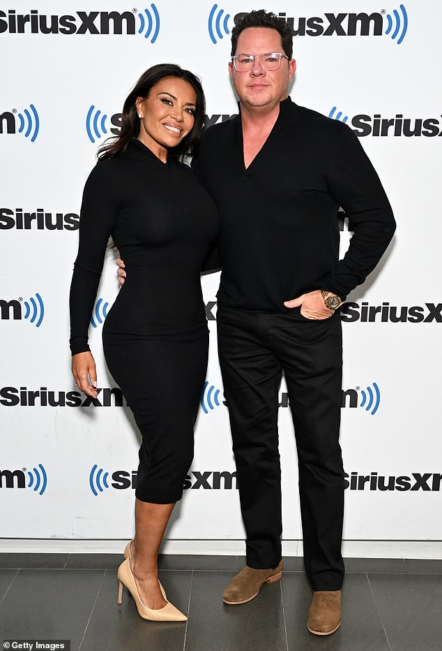 Charming couple: For the event, Catania coordinated outfits with her boyfriend, actor Paul Connell, who was dressed all in black.  Paul added suede boots, a gold watch and clear frame glasses