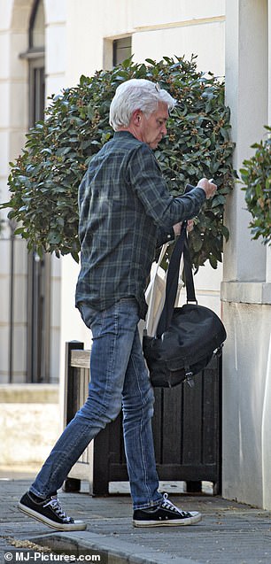 London digs: Phillip Schofield is seen arriving at his new flat in central London after announcing in 2020 that he is gay