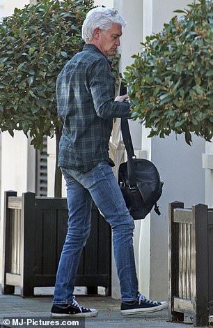 London digs: Phillip Schofield is seen arriving at his new flat in central London after announcing in 2020 that he is gay