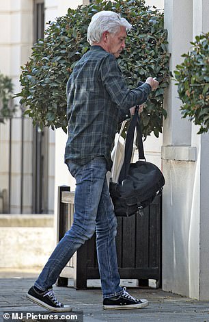 London digs: Phillip Schofield is seen arriving at his new flat in central London after announcing in 2020 that he is gay