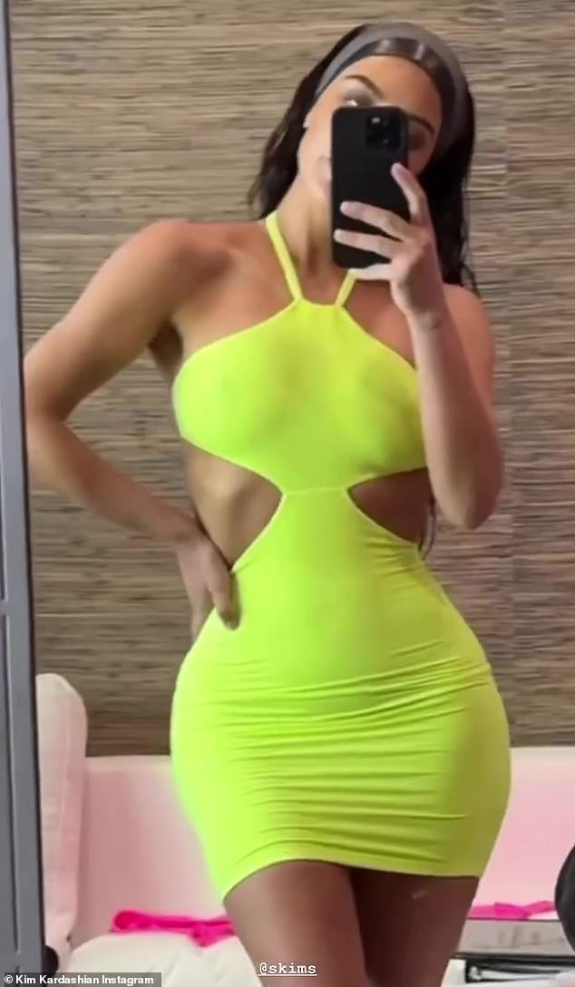 Let the sun in: Kim modeled a sexy neon yellow cut-out dress from the new SKIMS line