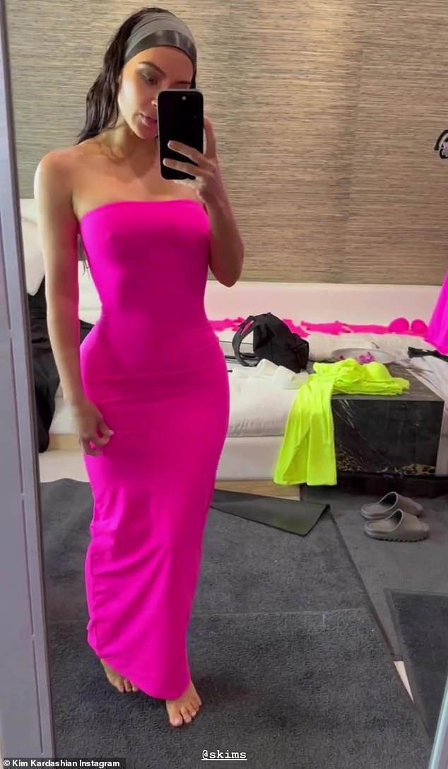 Pretty in pink: Kim noted on Instagram that she wore a dress similar to the neon pink SKIMS dress every day during her pregnancy