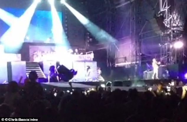 After a man came on stage to attack Justin, security guards came on stage and he turned over the piano to escape