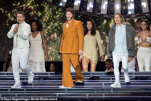 In style: Howard looked stylish for his performance in an orange suit, with the star sporting a white T-shirt under his jacket