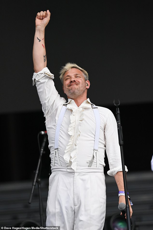 Smart bloke: The former Pop Idol winner, 44, wore a white shirt with ruffle detailing down the front