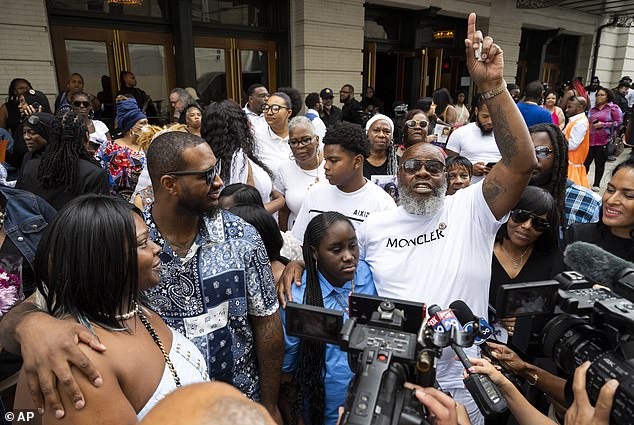 Sibley's father raised his arm to the sky in memory of his son during the celebration of life surrounded by family and friends