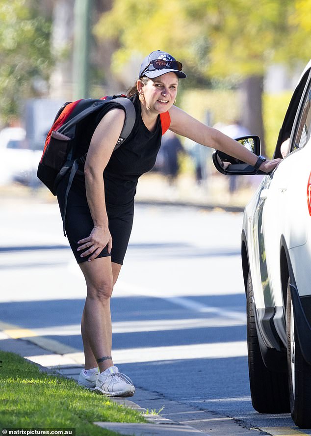 Reggie wore a light tank top and bike shorts and a pair of white sneakers for the final leg of the hike