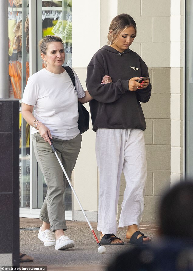 She opted for a simple white t-shirt and khaki pants for this trip, along with white sneakers