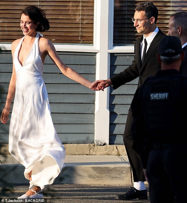 Hand in hand: Jack, a music producer, and Margaret, an actress, tied the knot on Saturday in the quaint seaside town of Beach Haven, New Jersey.  pictured outside reception