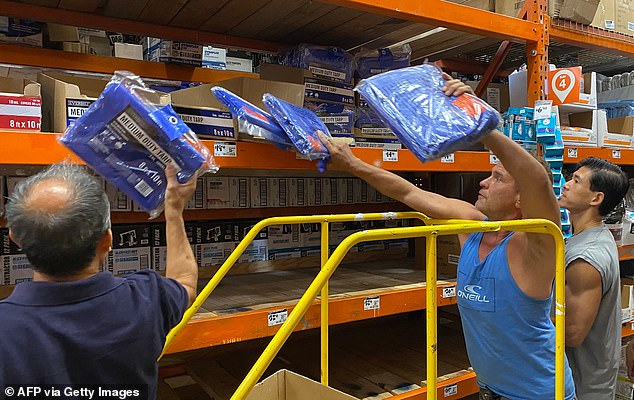 Customers rush to buy emergency supplies in Los Angeles on Saturday