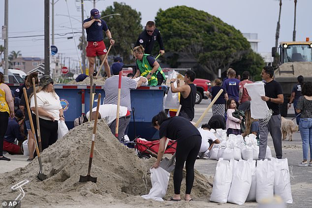 Long Beach lifeguards fill sandbags for residents ahead of Hurricane Hilary