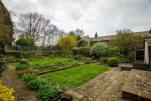 Green Thumbs: The spacious home sits on 5 acres with landscaped, south facing gardens and includes a four car garage