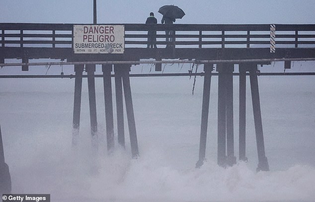 Tropical Storm Hilary makes landfall as California streets empty from