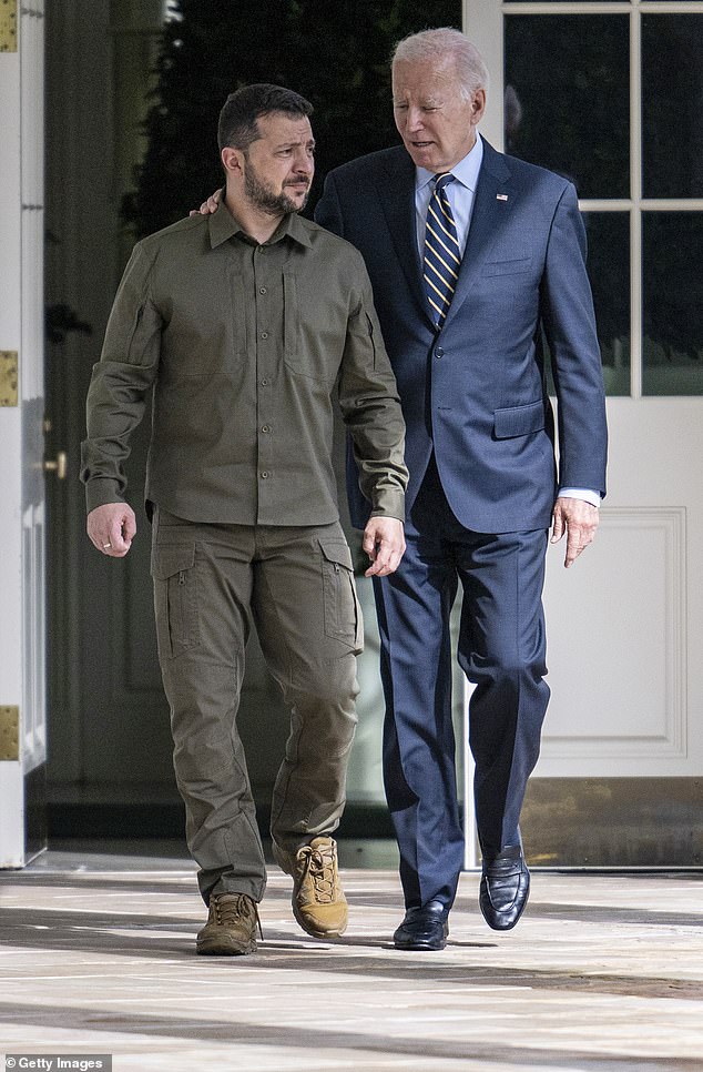 Ukrainian President Volodymyr Zelensky walks down the colonnade to the Oval Office during a visit to the White House with US President Joe Biden