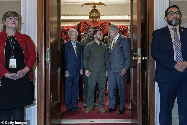 Senate Minority Leader Mitch McConnell (R-KY), Ukrainian President Volodymyr Zelensky and Senate Majority Leader Charles Schumer (D-NY) leave the Old Senate Chamber after meeting with senators