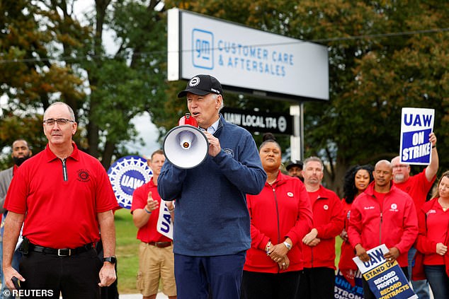 Shawn Fain (left), president of the United Auto Workers, joined President Joe Biden on the strike line in Michigan on Tuesday