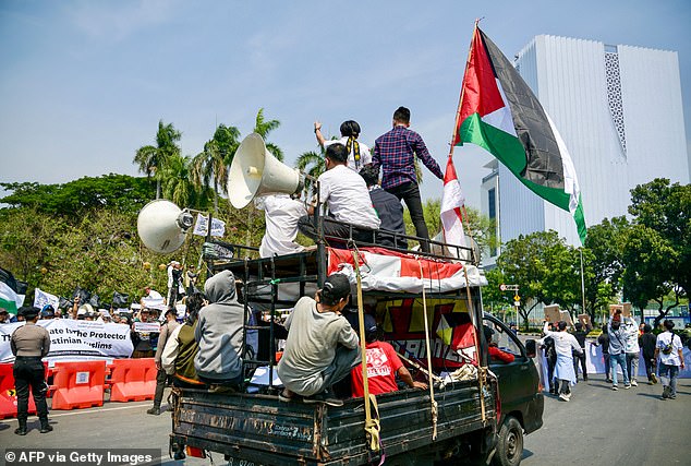 INDONESIA: More than 200 people also gathered in front of the national monument in the Indonesian capital on Friday, waving banners to express solidarity with Palestinians