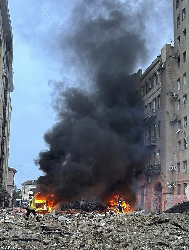 A Russian missile is seen exploding after hitting a building in Kharkiv on October 6