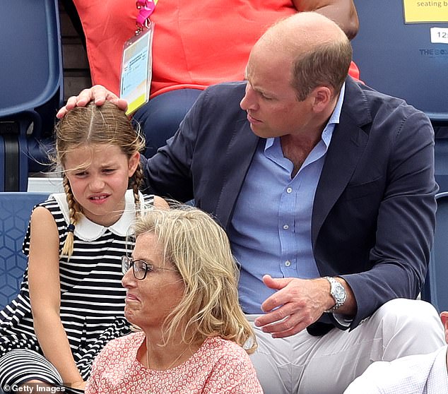 Prince William comforts his daughter Princess Charlotte as the royals attend the Birmingham Commonwealth Games ice hockey match in August 2022