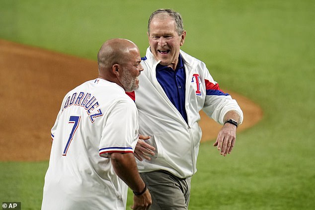 Bush laughs with Rodriguez after throwing out the first pitch to the Rangers-Diamondbacks