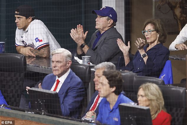 Bush (top C) and former first lady Laura Bush (top R) in the first inning of Friday night's game