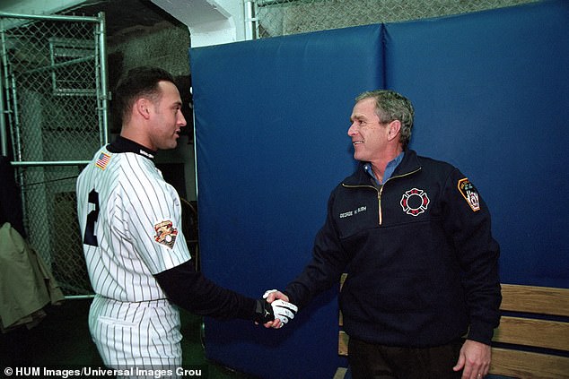 Bush shakes hands with Yankee shortstop Derek Jeter before Game 3 of the 2001 World Series