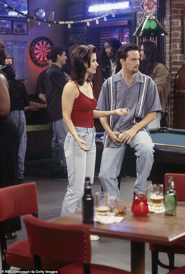 Hit series: Perry pictured with co-star Courteney Cox in an episode of Friends