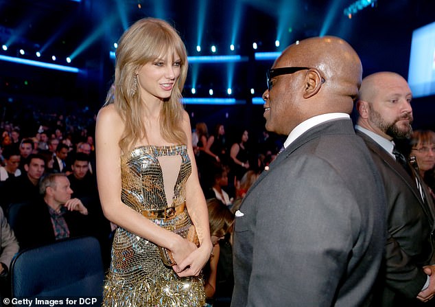 Reid has had a successful music career (pictured talking to Taylor Swift at the 2013 American Music Awards)