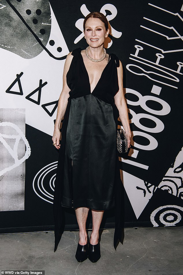 Looking good: Also at the event was Julianne Moore, who wore a black silk dress with a plunging neckline