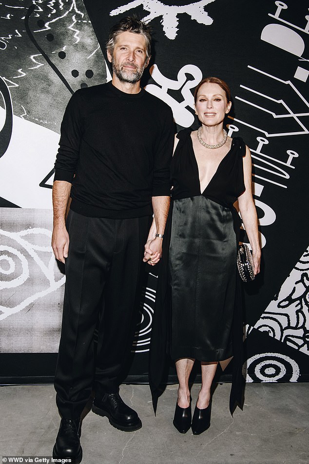 Couple: The star was joined by her husband Bart Freundlich, who wore a black sweater and pants