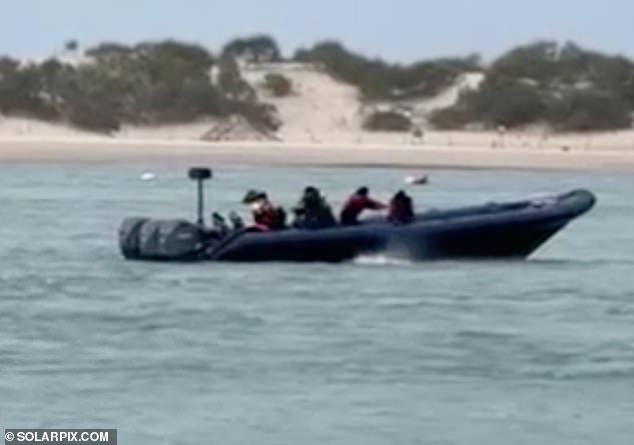 This is the sickening moment people smugglers push migrants into rip currents off a Spanish beach