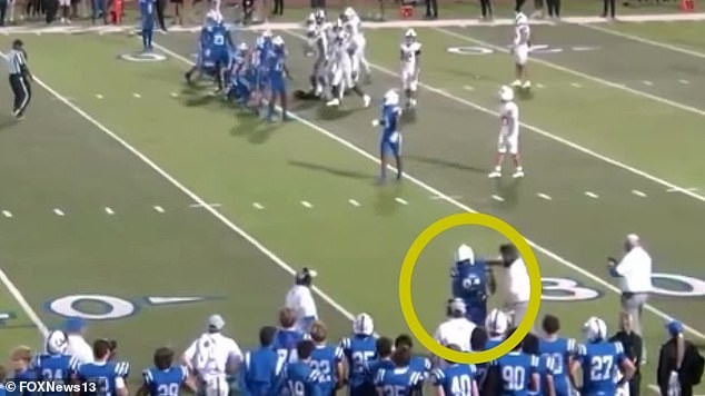 A shocking video shows the assistant football coach punching a