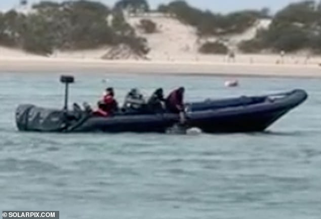 Shocking moment People smugglers push migrants off a motorboat into