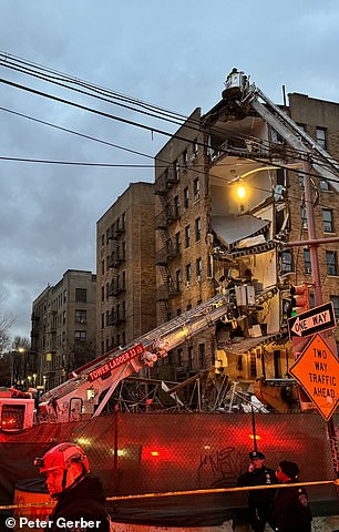 At the foot of the building lay a pile of sheet metal, bricks and metal rods