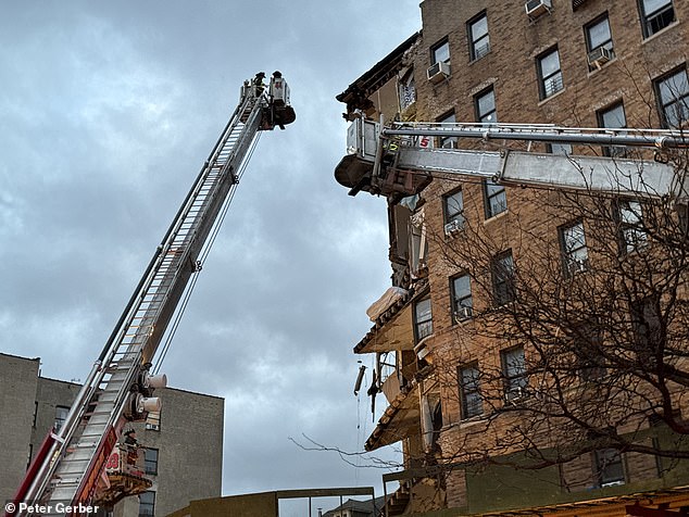 Rescue workers equipped with police dogs are searching for residents who may be trapped inside