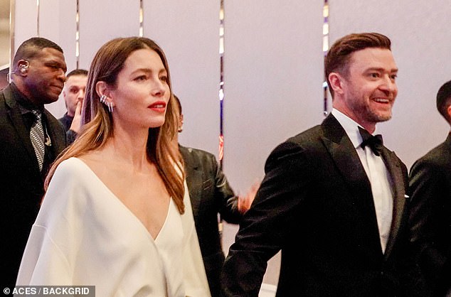 The 42-year-old singer, who performed at the star-studded event, cut a stunning figure in a black suit, white shirt and bow tie as he held hands with his 41-year-old actress wife