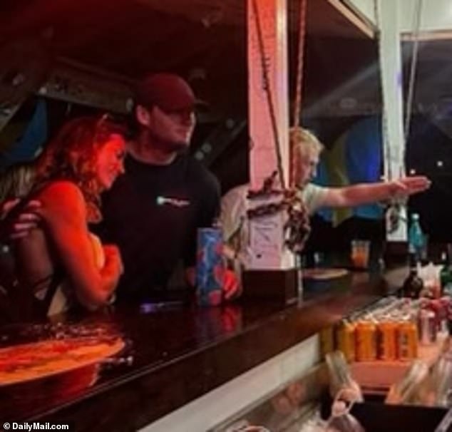 An unsuspecting Robert, 38, was photographed on July 16 befriending a mystery blonde at local bar Grabbers in the Bahamas, where his wife's new bartender, Terrance Bethel, 28, worked