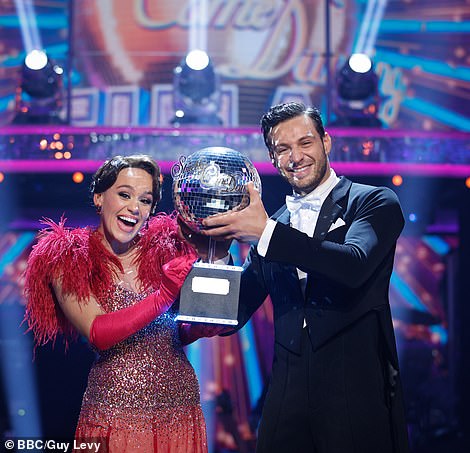 The couple couldn't wipe the smiles off their faces as they posed with the shiny trophy