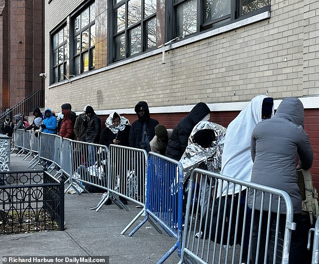 Hundreds of asylum seekers waiting for housing lined 7th Street and Avenue B in Manhattan in November