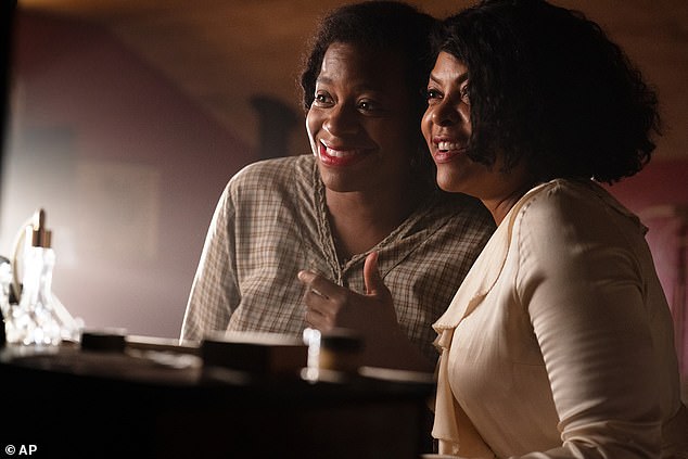 The Color Purple star was overcome with emotion as she spoke ahead of the release of The Color Purple about how she still feels underpaid compared to white actors in Hollywood (pictured with Fantasia Barrino).