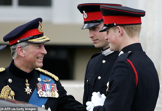 Prince Charles speaks with his two sons at Prince Harry's passing out ceremony at Sandhurst in 2006