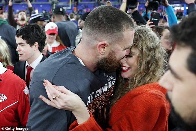 Taylor Swift and Travis Kelce share a passionate kiss on