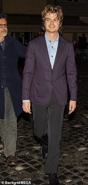 Joe donned a pinstripe jacket over his look