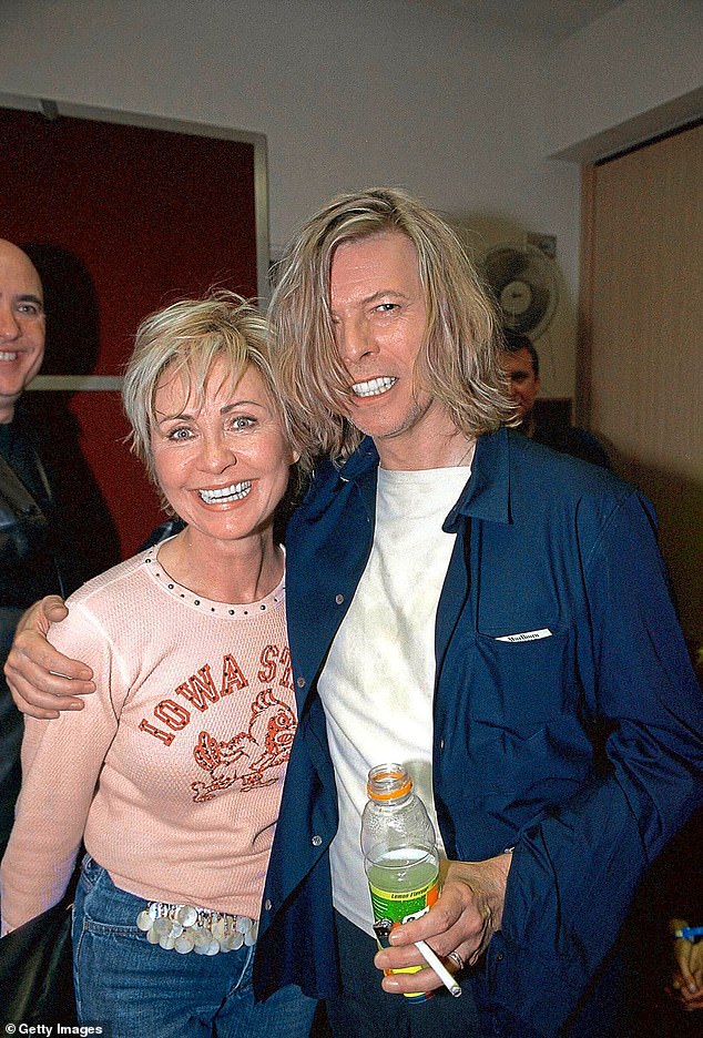 Following the announcement, Lulu also spoke to The Guardian about her mind-blowing all-star experiences in the spotlight - including personal experiences with icons like David Bowie, The Rolling Stones, Iggy Pop and The Who (pictured with Bowie in 2000).