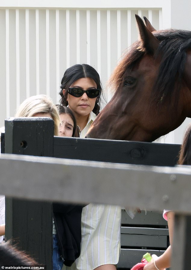 Kourtney and Penelope were seen petting and feeding a horse while taking a family trip