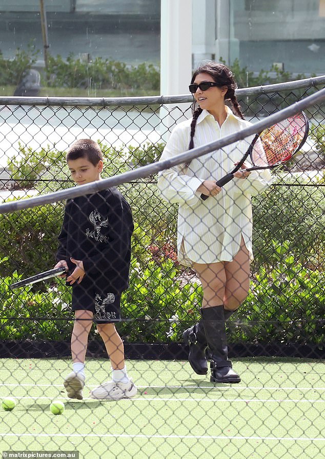 Kourtney was also seen getting active as she played tennis with her son Reign, who wore a black long-sleeved sweater and shorts