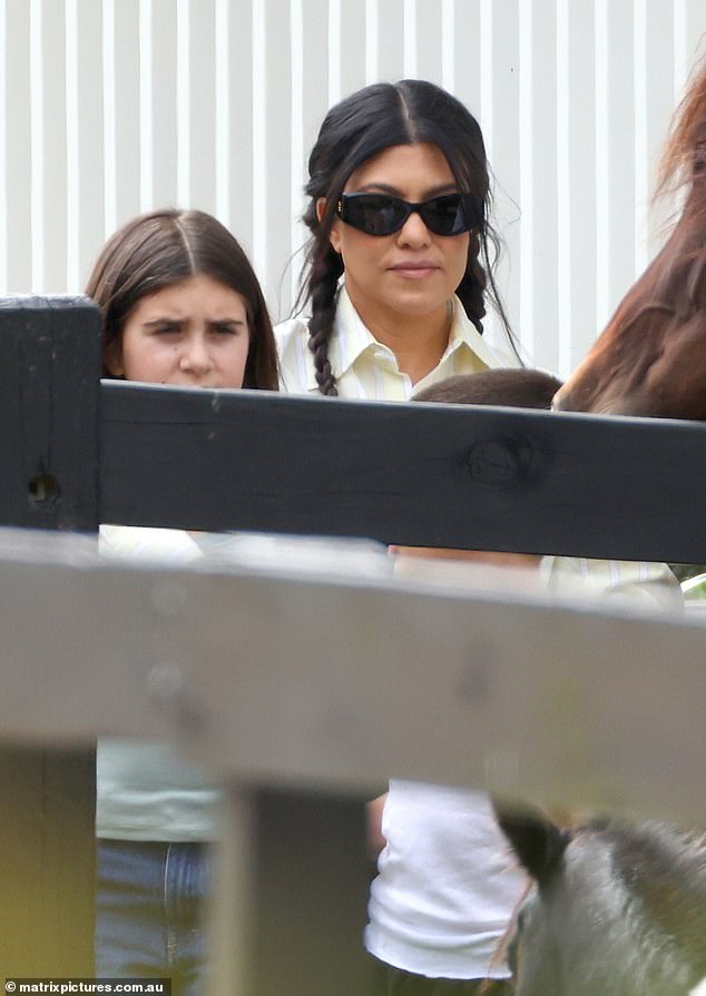 Kourtney accentuated her stunning features for the day out with a bronzed makeup palette