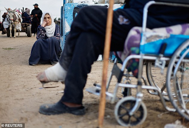 Palestinian patients rest as they arrive in Rafah after being evacuated from Nasser Hospital in Khan Younis due to the Israeli ground operation