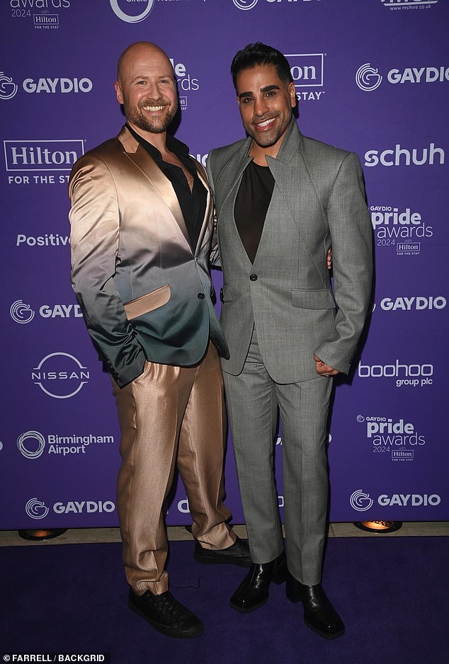 This Morning star Dr.  Ranj Singh is pictured alongside another guest on the purple carpet