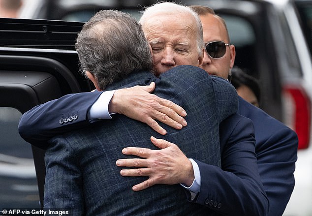 Joe39s Poison Ivy Biden HUGS scandal hit son Hunter as he